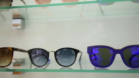 Cool blue glasses on the shelf Video stock 70687371