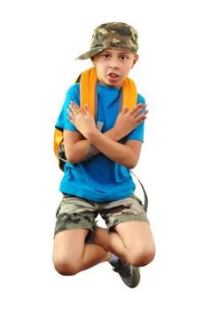 Cool boy with backpack and a cap jumping Stock Photos