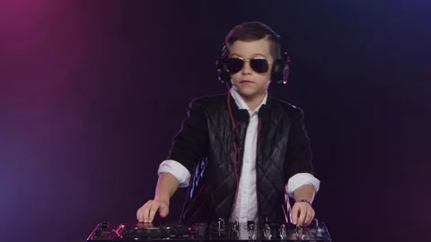 Cool boy dj with glasses playing on vinyl. Smoke background Stock Footage 75895490