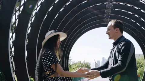 A cool couple in love with a guy and a girl dancing in the park Stock Footage 201969459