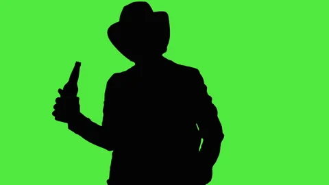 Cool cowboy in a hat with a bottle of beer Stock Footage 89779908