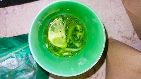 A cool cucumber and lemon refreshment with a lime accent. Stock Photos