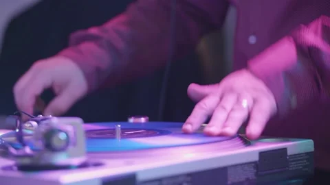 Cool DJ standing at the mixer controller booth at party composing nightclub mix Stock Footage 145811062