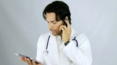 Cool doctor talking on the phone with patient Stock Footage
