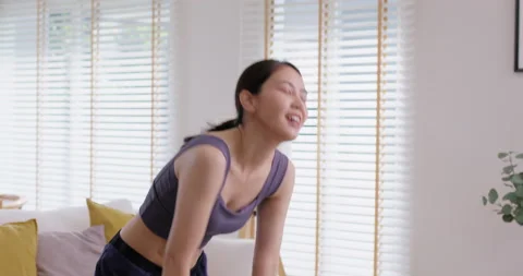 Cool down after finish exercise on online gym workout at cozy home. 스톡 동영상 230855718