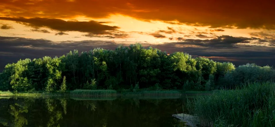 Cool dramatic sunset lake Stock Photos