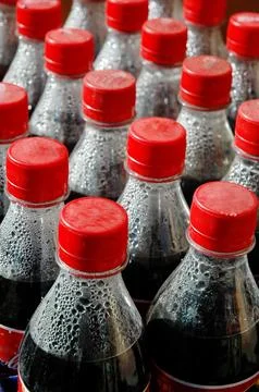 Cool Drink Bottles on table Stock Photos