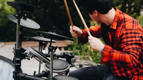 Cool drummer plays electronic drums. Nice slow motion footage. Stock Footage 114519472