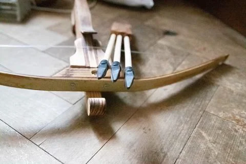 Cool front view close up of arrows and crossbow Stock Photos