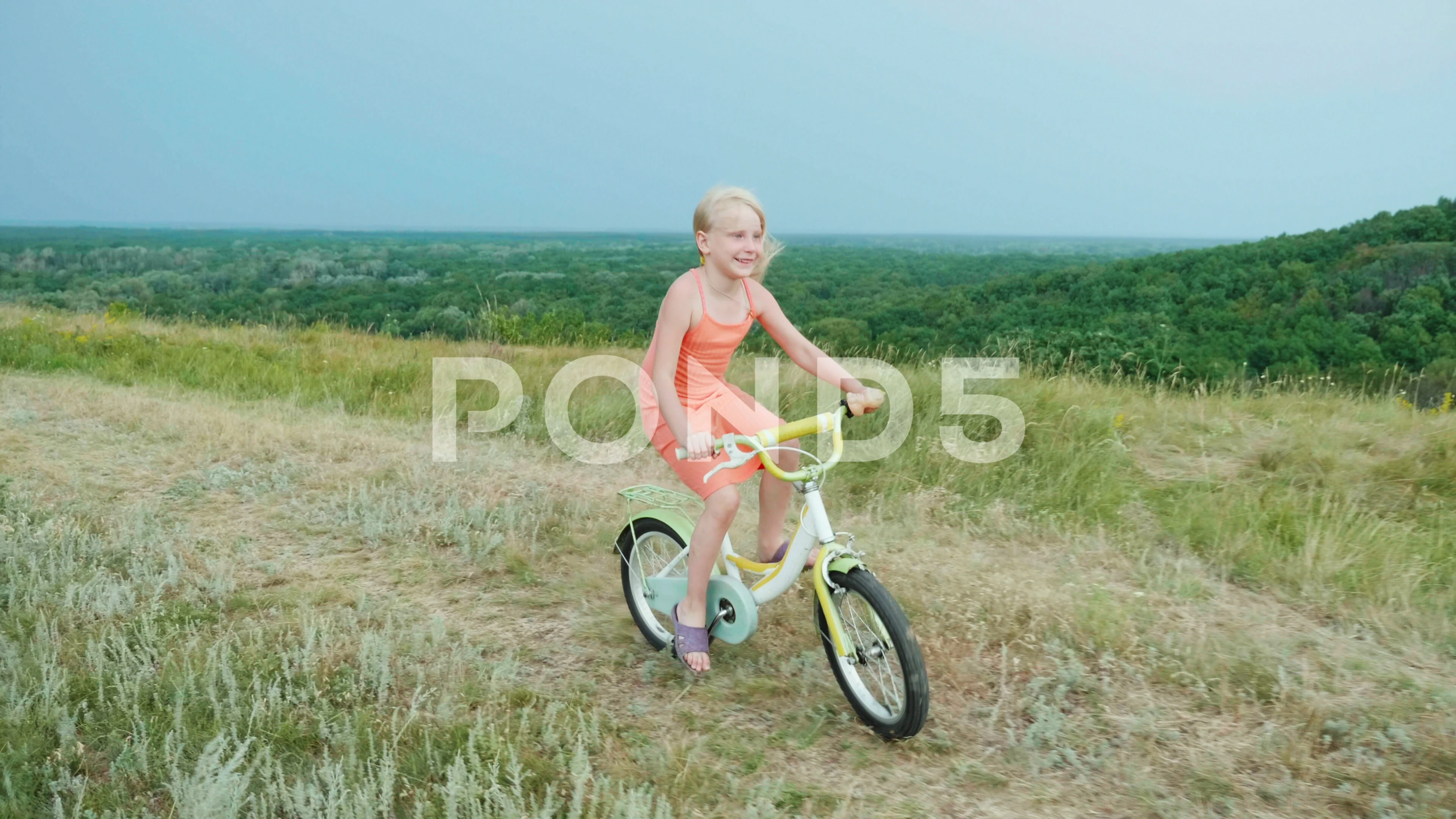 A cool girl in a pink dress rides a Stock Video Pond5