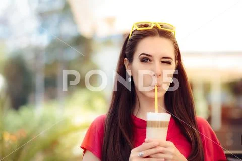 Cool Girl Winking and Sipping Summer Coffee Drink Stock-Fotos