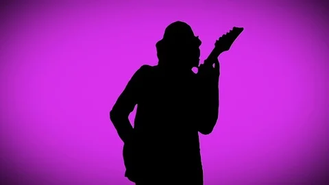 Cool Guitarist is Playing the Electric Guitar on the Pink Background Stock Footage
