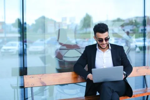 Cool guy arabic man uses laptop business center 스톡 사진