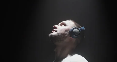 Cool guy dancing with arms in spotlight Stock Footage 244523950