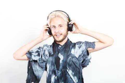 Cool guy having fun listens to music in headphones Stock Photos