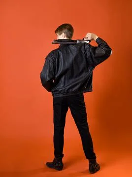 A cool hunter of evil spirits, a guy in a casual shirt and a leather jacket Stock Photos