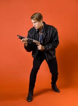 A cool hunter of evil spirits, a guy in a casual shirt and a leather jacket Foto stock