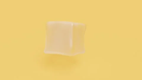 Cool ice cube on yellow back intro rotate endless Stock Footage 264349937