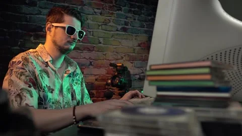 Cool IT Guy Inserting DVD Into Player in Front of Desktop Computer From 1990's Stock Footage 305821836