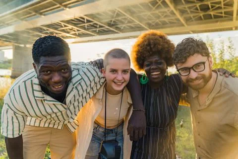 Cool, laid-back, smiling group of diverse people having fun, laughing at camera Stock Photos