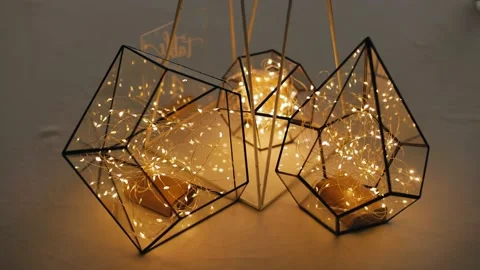 Cool light decoration on the table. Light polygons with warm light Stock Footage 209244807