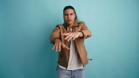 Cool long haired man dancing and singing hip hop music in a studio Stock Footage 333073682