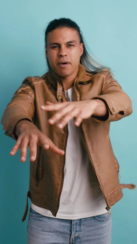 Cool long haired man dancing hip hop in studio. Vertical Stock Footage 339326007