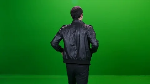 Cool Man in Leather Jacket Winking on Green Screen Vídeos de archivo 83734460
