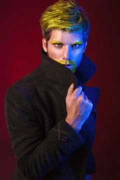 Cool Man in the Light Colored Spotlights. Stock Photos