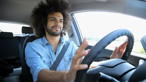Cool man listening music while driving Stock Footage 37221438
