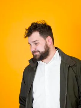 Cool man posing in front of orange background Foto stock
