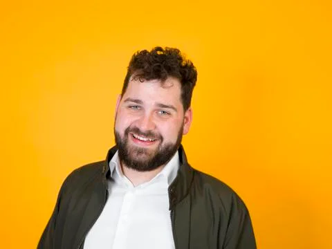 Cool man posing in front of orange background Stock Photos