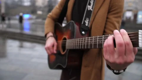 Cool man's hands playing guitar on the street close shoot. Stock Footage 151329550