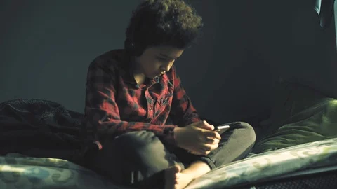 Cool mixed boy in the room  listening a music Stock Footage 128999859