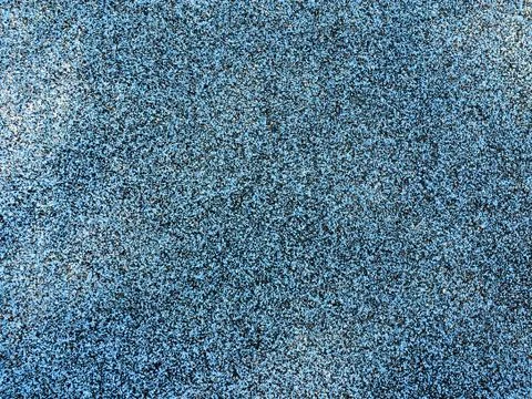 Cool modern background of recycled rubber tires blue and black playground floor Stock Photos