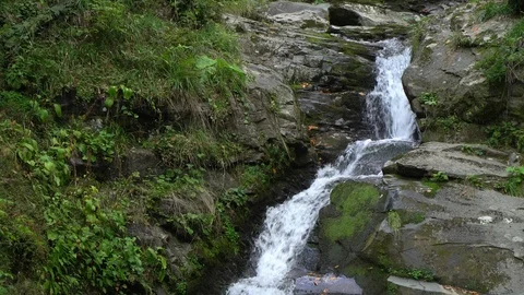 Cool mountain stream runs fast on brown rocks close view Stock Footage 116869522