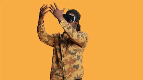 Cool person using virtual reality headset on camera Stock Photos