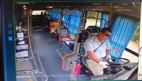 Cool reaction of bus driver after mobile phone charger explodes inside passen... Video stock 106298560