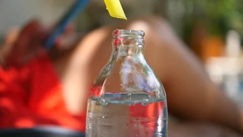 Cool refreshing bottle with soda and yellow tube inside. HD, 1920x1080, slow Stock Footage 95937453