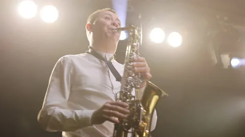 Cool saxophonist performing an amazing solo. Musician doing a concert. Sax Stock Footage