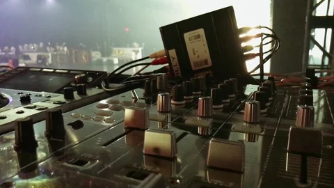 Cool shot of DJ Table with Mixer on a Stage before a Concert Stock Footage 84917942