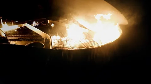Cool shots of a burning piano at night. Shooting in slow motion. Stock Footage 339304536