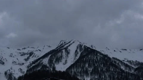 Cool shots of clouds over high snowy mountains. Taken by timelapse Stock Footage 157889825