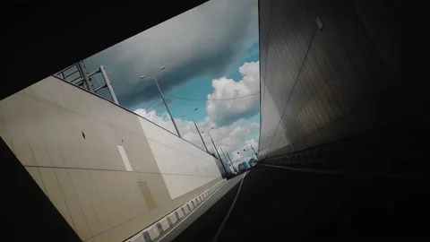 Cool shots on the way out of a dark tunnel by car Stock Footage 160337032