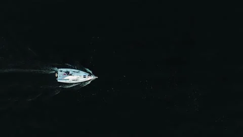 Cool shots of a yacht sailing on dark water. Top view of a pleasure yacht Stock Footage 220155748