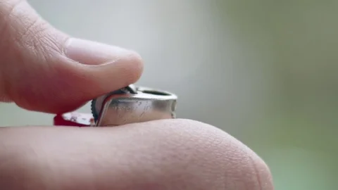 Cool slow-mo shot of flame bursting out of brown lighter Stock Footage 84489405