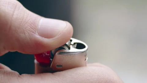 Cool slow-mo shot of flame bursting out of brown lighter Stock Footage 84489518