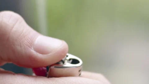 Cool slow-mo shot of flame bursting out of brown lighter Stock Footage 84489861