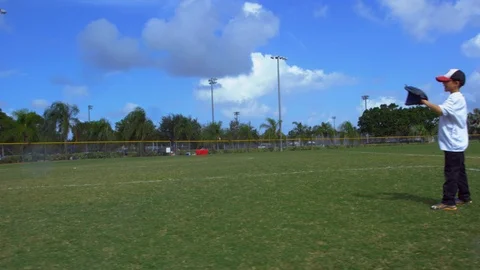 Cool slow motion of kid catching ball during baseball practice Stock Footage 85645179