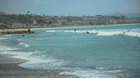 Cool slow motion shot of surfers in the ocean Stock Footage 63887664